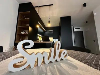 a room with a sign that says sanchez on the floor at 1BR Modern condo near the University in Sofia