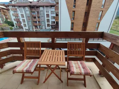 two chairs and a table on a balcony at Belvedere K203 in Bansko