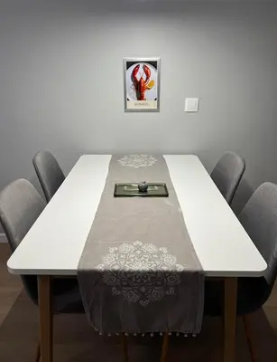 a table with a table cloth on top of it at Boston Cozy Elegant Family Apt w Parking Near NSA in Sofia