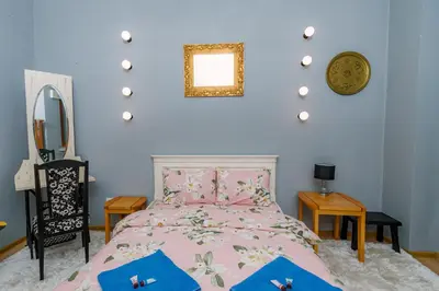 a bedroom with a pink bed and a mirror at Top Center, 3BDR, Heart of the city, FREE Secured Parking in Sofia