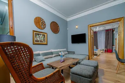a living room with a couch and a table at Top Center, 3BDR, Heart of the city, FREE Secured Parking in Sofia