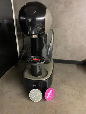 a coffee machine with a cup on top of it at SOFIA CENTRAL LUXURY apartment 