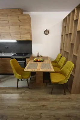 a dining room with a table and yellow chairs at SOFIA CENTRAL LUXURY apartment 