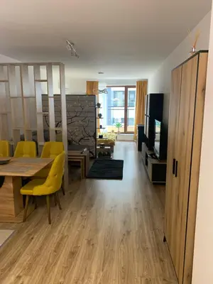 a living room with a dining room table and yellow chairs at SOFIA CENTRAL LUXURY apartment 