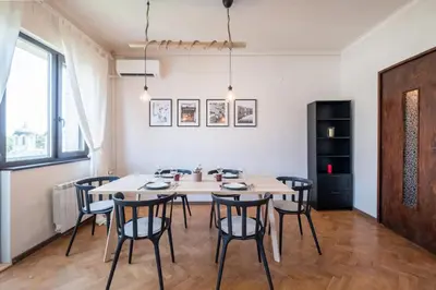 a dining room with a table and chairs at Orange friendly apartment near Vitosha blvd in Sofia