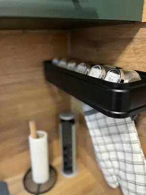 a shelf with a bunch of remote controls and a remote control at Elizi winter apartments Pamporovo in Pamporovo