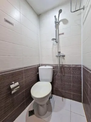 a bathroom with a toilet and a shower at 8BD Retreat in Bansko Comfort & Mountain Charm by Flat Mаnager in Bansko