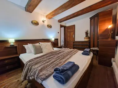 a bedroom with a large bed with towels on it at 8BD Retreat in Bansko Comfort & Mountain Charm by Flat Mаnager in Bansko