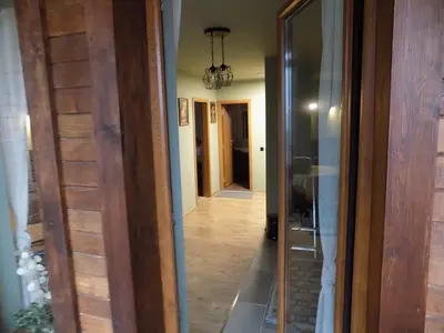 a hallway leading into a house with a mirror at La'Vista in Smolyan