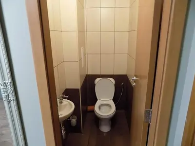 a small bathroom with a toilet and a sink at La'Vista in Smolyan