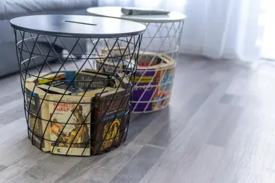 a basket filled with wine bottles on top of a wooden floor at PARADISE RELAX APARTMENT in Bansko
