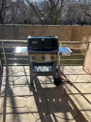 a grill sitting on top of a patio at Вила Маунтайн Вю in Brestnik