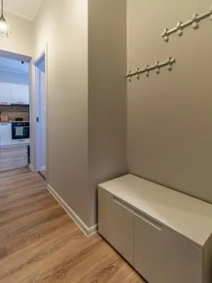 an empty room with a desk and a hallway at Eiffel Elegance - Stylish Sofia Apartment in Sofia