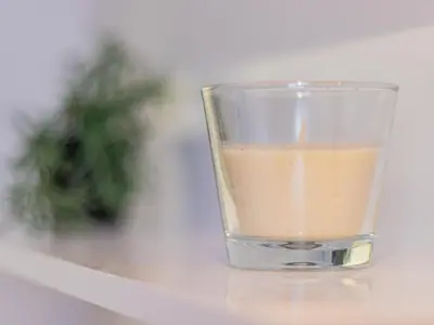 a glass of coffee sitting on a table at Louvre Loft: Charming Studio in Central Sofia in Sofia