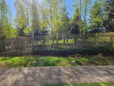 a garden with a fence and a walkway at TERRA KOMPLEX D3 - Private apartment - Golf, Skiing & SPA in Razlog