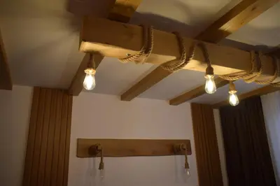 a track light hanging from a ceiling with lights at Супер луксозен апартамент в Winslow in Bansko