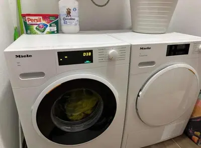 a white washing machine sitting in a kitchen at Apart-Hotel Crown Bansko in Bansko