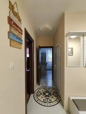 a hallway with a welcome mat on the floor at Newly renovated 2 bedroom apartment in Sofia in Sofia