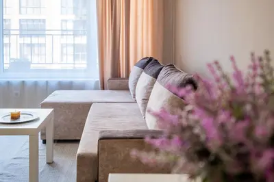 a living room with a couch and a table at Cozy Homes 1 in Sofia