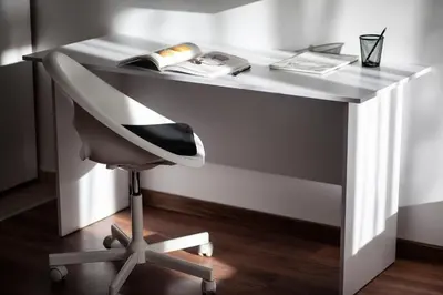 a white desk with a chair and a book at White Сozy Studio A next to the Gondola in Bansko