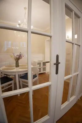 a room with a table and a glass door at Planeta dos sonhos - Fast Wi-Fi, 1BDR, Top centre in Sofia