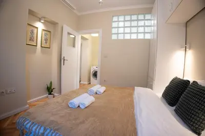 a bedroom with a large bed with towels on it at Planeta dos sonhos - Fast Wi-Fi, 1BDR, Top centre in Sofia