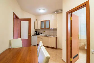 a kitchen with a wooden table and a dining room at Charming one bed apartment 423 in main Flora building in Borovets