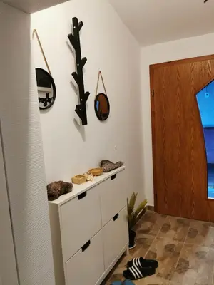 a room with a white cabinet and a wooden door at Charming City Apartment SIYANA - Self Check-in in Panagyurishte