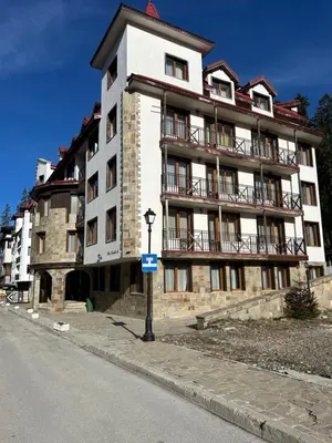 a large building on the side of a street at The Castle Bonko in Pamporovo