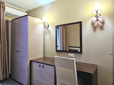 a room with a desk and a mirror on the wall at Suite in Dream Bansko in Bansko