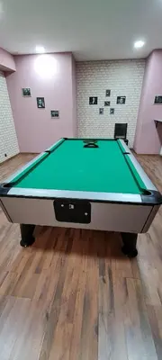 a ping pong table in a room with at Suite in Dream Bansko in Bansko