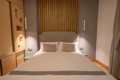 a bedroom with a large white bed with two pillows at Luxury room 12-3 in Plovdiv