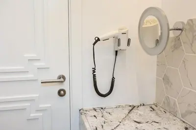 a phone hanging on a wall next to a door at Luxury room 12-3 in Plovdiv