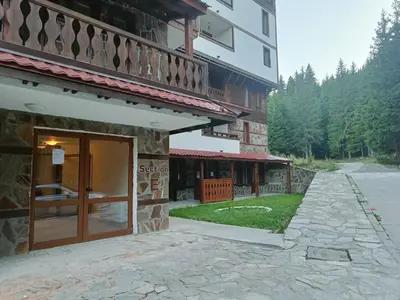 a building with a door in front of it at Студио Орфееви Скали in Pamporovo