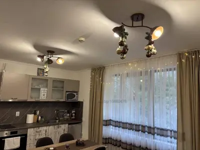 a kitchen with a dining table and a window at Апартамент за гости 4а26 Планинска Магия Grand Monastery Пампорово in Pamporovo