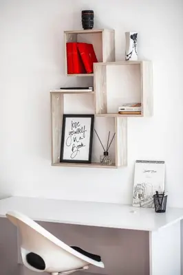 a white desk with wooden shelves on a wall at New White Studio F next to Forest the Gondola in Bansko