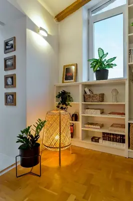 a living room with a chair and plants at Dreamy Sunset Loft in Sofia City Center in Sofia