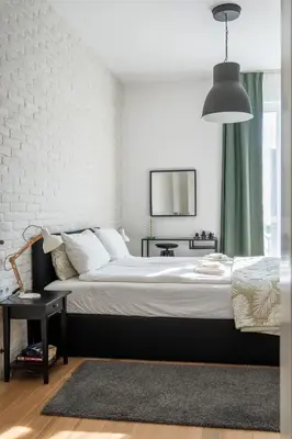 a bedroom with a large bed and a mirror at Elegant Getaway Near Iconic Eagles' Bridge in Sofia