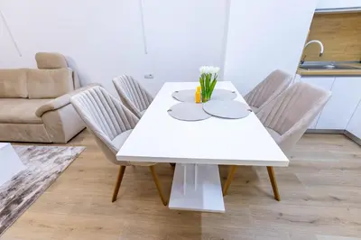 a white table and chairs in a living room at Bellalux in Sandanski