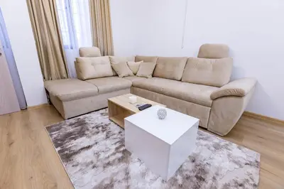 a living room with a couch and a coffee table at Bellalux in Sandanski
