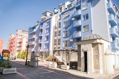 a blue building with a gazebo in front of it at Flower house 9 in Sofia