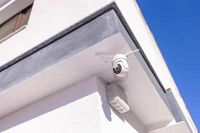 a white door with a security camera on it at Topalov in Sandanski