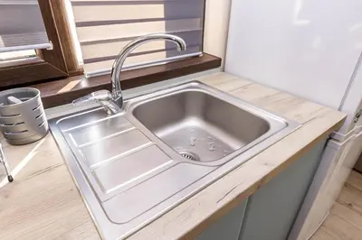 a kitchen sink with a faucet in a kitchen at Topalov in Sandanski