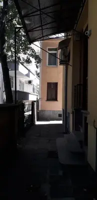 an empty alley with a building in the background at Studio V Plovdiv in Plovdiv