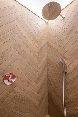 a bathroom with a shower with a wooden floor at SOFapart Boutique Apartments in Sofia