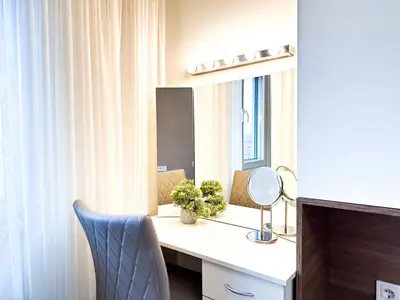 a room with a desk with a mirror and a chair at Doynov's Apartment in Sofia