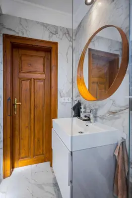 a bathroom with a sink and a mirror at Cozy Heaven at Vitosha Blvd - Sofia - 2BDR in Sofia