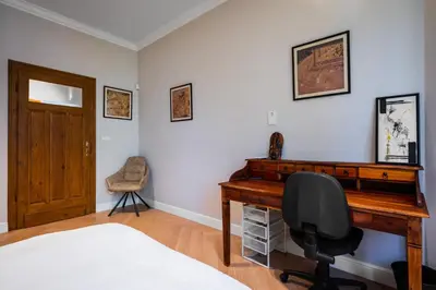 a bedroom with a desk and a chair at Cozy Heaven at Vitosha Blvd - Sofia - 2BDR in Sofia