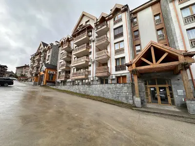 an empty street in front of a large building at Bansko Ski Resort Apartment 2-3 people in Bansko
