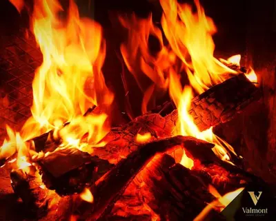 a fire is burning in a fireplace with flames at Valmont Luxury Chalet in Glozhene